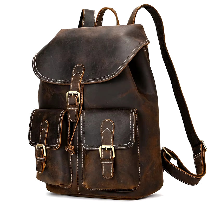 Presenting the Vintage Leather Backpack: expertly crafted from premium cowhide leather, it features two front pockets with secure buckle straps. Its flap top is adorned with stitching details, and adjustable shoulder straps ensure it's a durable travel companion with a timeless and rugged appearance.