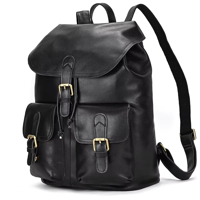 The Vintage Leather Backpack is made from premium cowhide leather and showcases a flap top with two front buckle pockets. It features adjustable straps and gold-toned hardware, making it an ideal travel accessory. The backpack is elegantly displayed on a white background.