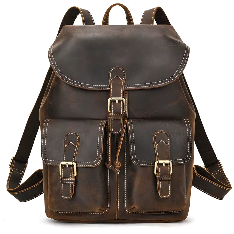 The Vintage Leather Backpack is expertly made from premium cowhide leather, showcasing a flap cover and two front pockets with secure buckles. This sturdy travel accessory features adjustable shoulder straps and refined white stitching along the edges for a touch of elegance.