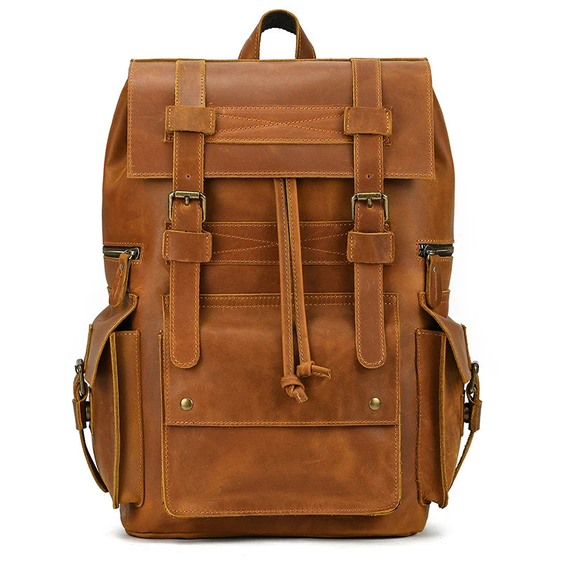 The Genuine Leather Travel Backpack in tan boasts multiple pockets and buckled front straps. It features side pockets secured with straps and metal clasps, along with a top handle for easy carrying. Crafted from durable cow leather, it exudes vintage aesthetics with its smooth, polished finish.