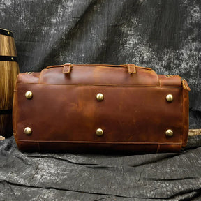 Weekender 20 Leather Travel Bag with durable alloy hardware and genuine cowhide material, perfect for travel.