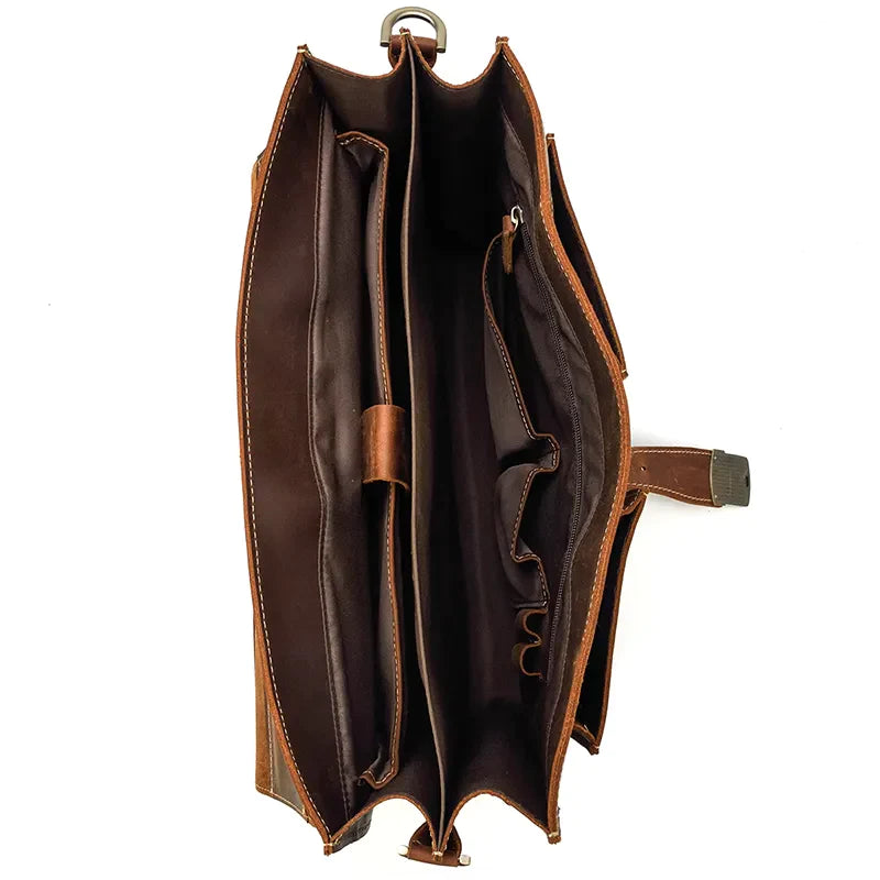 A top-down view of an open Leather 16" Business Briefcase in rich brown genuine cowhide leather, featuring multiple compartments and pockets. The empty business briefcase showcases its organizational sections and interior design against a plain white background.