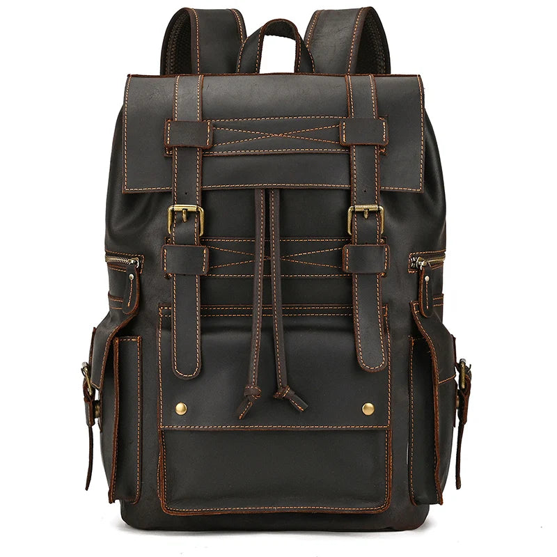 The Genuine Leather Travel Backpack boasts a rugged, vintage appearance and is crafted from genuine cow leather. It features multiple compartments and detailed brown stitching. The design includes a top flap secured by two buckled straps, a front pocket with dual buckle closures, and two side pockets also outfitted with buckle closures.