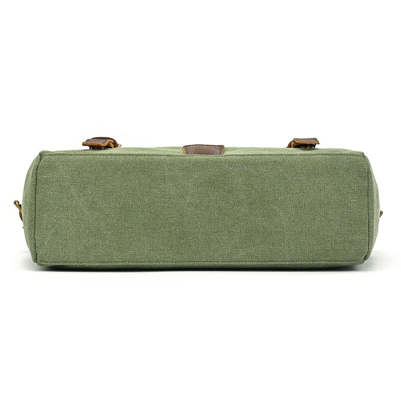 The Canvas & Leather Vintage Messenger Bag is a rectangular green canvas bag with business style, brown genuine leather accents, and a structured shape reminiscent of classic briefcases, revealed from the bottom view.