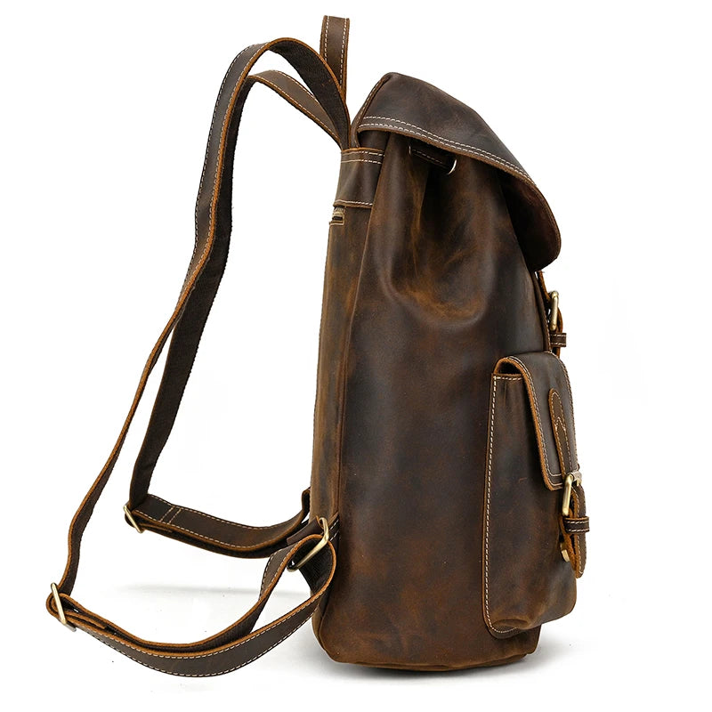 Side view of the Genuine Leather Vintage Backpack in casual brown, showcasing a flap closure, adjustable straps, and a side pocket with a buckle. Constructed from genuine leather, the material offers a slightly worn vintage appearance that enhances its appeal.