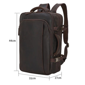 The Vintage Leather Travel Backpack is a dark brown leather bag, crafted from genuine leather with multiple compartments and adjustable straps. Designed with men in mind, it measures 44cm in height, 31cm in width, and 17cm in depth.