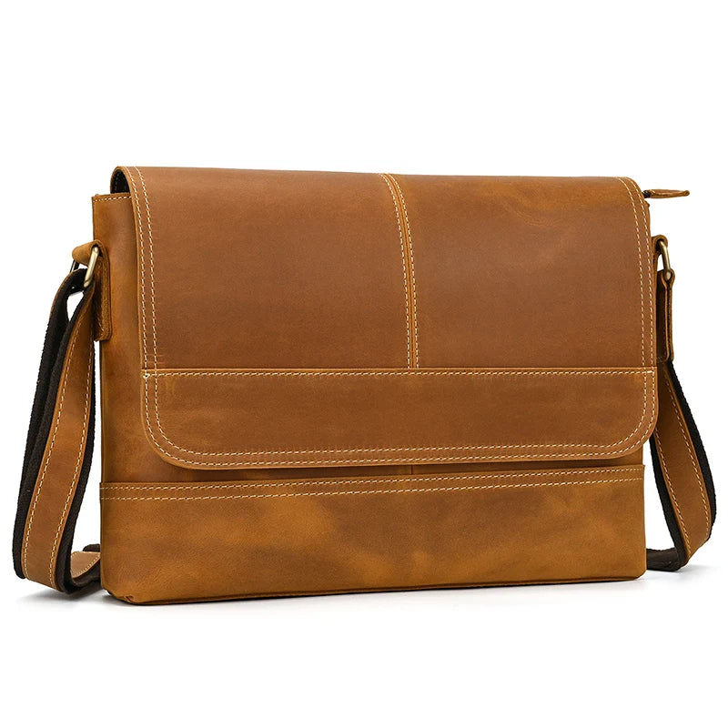 Introducing the Vintage Genuine Leather Messenger Bag: a versatile accessory crafted from rich brown leather, complete with a flap and an adjustable shoulder strap. It features visible stitching and a minimalistic design, offering casual elegance with its slightly worn, rustic appearance.