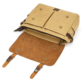 The Canvas & Leather Vintage Messenger Bag is open, displaying its khaki exterior with brown genuine leather interior and straps. It has metal buttons and a zipper, revealing spacious compartments—ideal for those who prefer a business style to traditional briefcases.