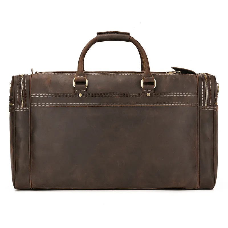 A brown leather Luggage 24 Leather Travel Bag with dual handles and multiple zipper compartments. This travel bag features sturdy stitching and has a rectangular shape with rounded edges, making it the perfect companion for any journey.