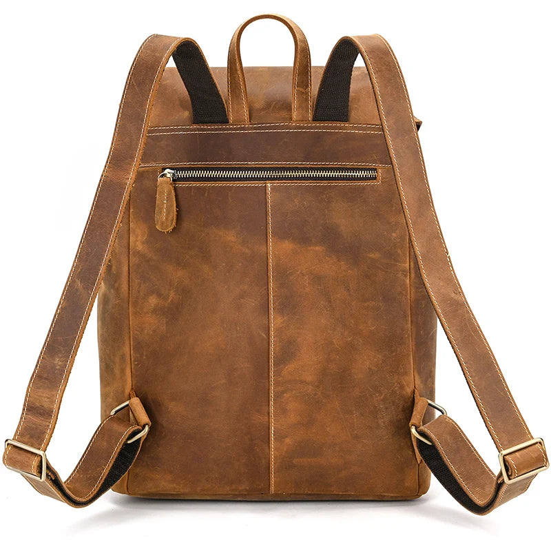 The Genuine Leather Vintage Backpack for men features adjustable straps and a zippered back pocket. It is crafted from genuine leather with a vintage finish that gives it a classic and rugged look, ideal for casual style, and stands upright to highlight its back side.