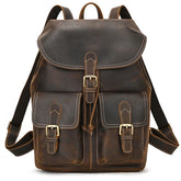 Introducing the Genuine Leather Vintage Backpack: a casual brown softback crafted from genuine leather, adorned with white stitching. It features two front pockets with buckle closures and adjustable shoulder straps for added comfort.