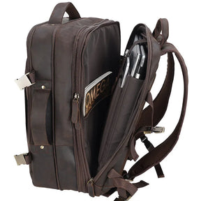 The Vintage Leather Travel Backpack, crafted in rich brown leather, features a side compartment that holds a laptop, pens, and a book. It is designed with adjustable shoulder straps and metal buckles, seamlessly blending functionality with timeless appeal.