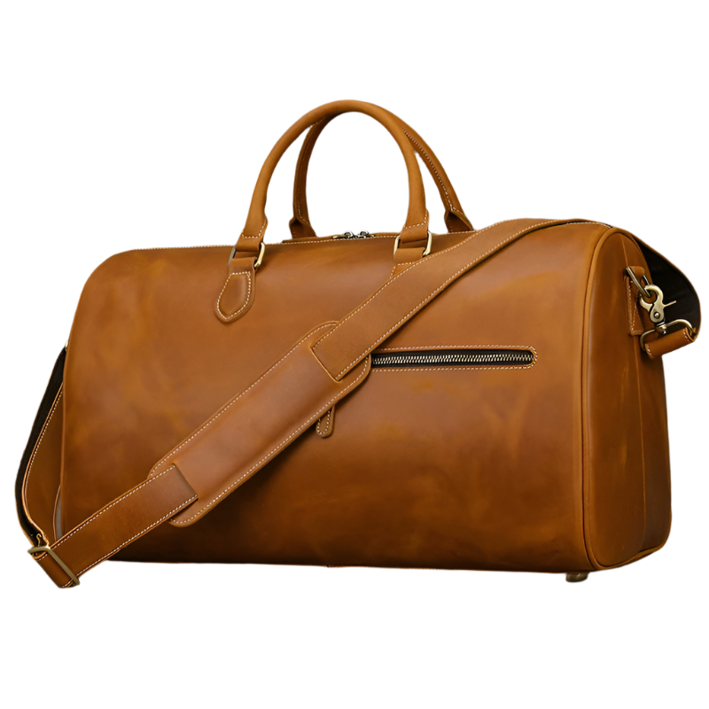 The Leather Travel Duffle is a large vintage brown bag made of genuine leather, featuring a shoulder strap, sturdy handles, side zippered pocket, and metal feet for stability.